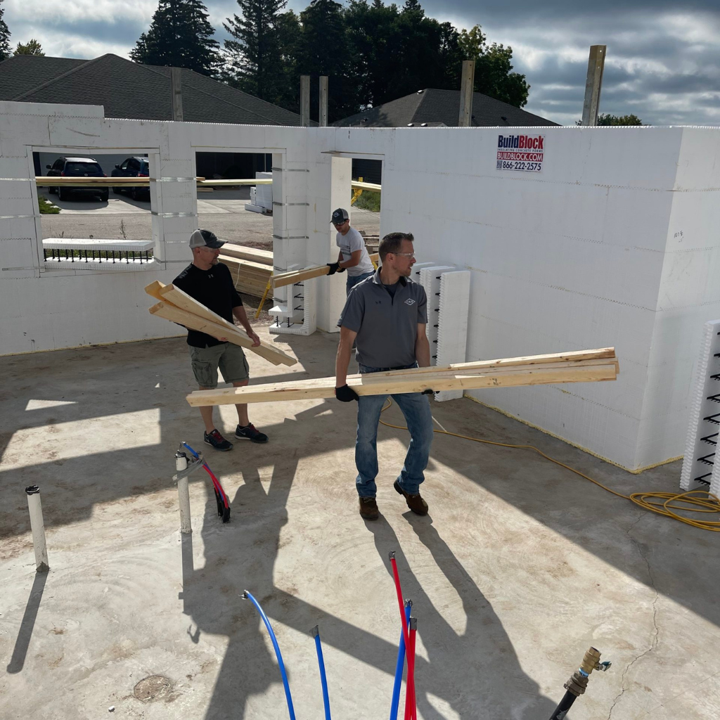 c&b employees building a house